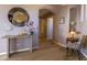 Hallway featuring decorative table with flowers, lighting, mirror, and a chair at 14850 E Grandview Dr # 233, Fountain Hills, AZ 85268