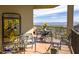 Covered patio offering stunning views of mountains and desert landscape at 14850 E Grandview Dr # 233, Fountain Hills, AZ 85268