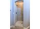 Walk-in shower featuring neutral tile and updated shower head at 14850 E Grandview Dr # 233, Fountain Hills, AZ 85268