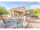 This backyard features both an outdoor seating and dining area perfect for relaxing and entertaining at 15237 S 47Th Way, Phoenix, AZ 85044