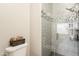 Updated gray tiled shower stall with glass door and modern shower head at 15237 S 47Th Way, Phoenix, AZ 85044