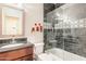 Well-lit bathroom with a granite countertop, tiled shower and modern fixtures at 15237 S 47Th Way, Phoenix, AZ 85044