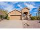 Charming single-Gathering home with a well-maintained front yard, desert landscaping, and a two-car garage at 15237 S 47Th Way, Phoenix, AZ 85044