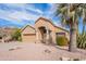 Charming single-story home with desert landscaping, a palm tree, and an arched front porch at 15237 S 47Th Way, Phoenix, AZ 85044