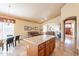 Open-concept kitchen and living area featuring a large island with granite countertops at 15237 S 47Th Way, Phoenix, AZ 85044