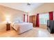 Comfortable bedroom with natural light, hardwood floors and traditional furnishings at 15237 S 47Th Way, Phoenix, AZ 85044