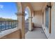 Covered balcony with arched supports that has great natural light and city views at 15635 W Montecito Ave, Goodyear, AZ 85395