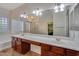 Bathroom featuring a large vanity with double sinks and large mirrors and fixtures at 15635 W Montecito Ave, Goodyear, AZ 85395