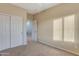 Cozy bedroom with carpet flooring, closet, and natural light at 15635 W Montecito Ave, Goodyear, AZ 85395