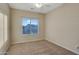 Neutral bedroom with ceiling fan, carpet and window view at 15635 W Montecito Ave, Goodyear, AZ 85395