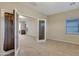 Bonus room featuring carpet floors, neutral walls, and glass french doors at 15635 W Montecito Ave, Goodyear, AZ 85395