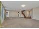 Spacious living room with carpet flooring, large windows, neutral color palette, and ample space for furnishings at 15635 W Montecito Ave, Goodyear, AZ 85395