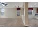 Spacious living room with plush carpeting, neutral walls, and recessed lighting at 15635 W Montecito Ave, Goodyear, AZ 85395