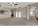 Inviting living room featuring an open floor plan with easy access to the adjacent kitchen and dining area at 15635 W Montecito Ave, Goodyear, AZ 85395