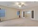 Spacious living room featuring carpet floors, bright natural light, and sliding glass doors at 15635 W Montecito Ave, Goodyear, AZ 85395