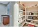 Walk-in pantry with white shelving for ample storage at 15635 W Montecito Ave, Goodyear, AZ 85395