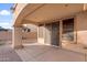 A covered patio featuring three sliding glass doors and view of the yard at 15635 W Montecito Ave, Goodyear, AZ 85395