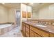 Bathroom featuring a double vanity with granite countertops and two vessel sinks at 15802 N 71St St # 604, Scottsdale, AZ 85254