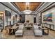 Elegant living room with a cozy fireplace, modern decor, and a stylish wooden ceiling at 15802 N 71St St # 604, Scottsdale, AZ 85254