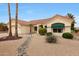 Inviting single-story home featuring a desert-friendly landscape, red tile roof, and charming curb appeal at 16004 W Falcon Ridge Dr, Sun City West, AZ 85375