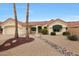 Inviting single-story home featuring a desert-friendly landscape, red tile roof, and charming curb appeal at 16004 W Falcon Ridge Dr, Sun City West, AZ 85375