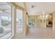 Bright living room featuring tile floors, light walls, and view of the backyard at 16004 W Falcon Ridge Dr, Sun City West, AZ 85375