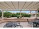 View of a charming covered patio featuring outdoor furniture and garden decor at 16004 W Falcon Ridge Dr, Sun City West, AZ 85375