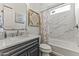 Stylish bathroom featuring a shower over tub, a marble countertop, and decorative details at 175 E Santa Lucia Ln, Queen Creek, AZ 85140