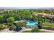 Aerial view highlighting community pool area, lush landscaping, and golf course views at 175 E Santa Lucia Ln, Queen Creek, AZ 85140