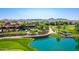 Exterior image showing the community space with desert landscaping, lawn, and a placid pond at 175 E Santa Lucia Ln, Queen Creek, AZ 85140