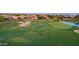 Golf course view highlighting the sand traps, green, and tranquil pond at 175 E Santa Lucia Ln, Queen Creek, AZ 85140