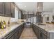 Modern kitchen featuring a stainless steel hood vent, stainless steel appliances, and a granite island at 175 E Santa Lucia Ln, Queen Creek, AZ 85140