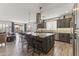 Spacious kitchen featuring a large kitchen island with bar stool seating and stainless steel appliances at 175 E Santa Lucia Ln, Queen Creek, AZ 85140