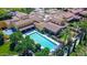 Aerial view of a large community pool with mature landscaping and sun loungers at 175 E Santa Lucia Ln, Queen Creek, AZ 85140