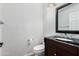 Powder room featuring a dark vanity with a vessel sink and modern fixtures at 19333 N 68Th Ave, Glendale, AZ 85308