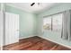 Bright bedroom with wood floors, neutral paint, and a large window with lots of light at 19333 N 68Th Ave, Glendale, AZ 85308