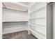 Walk-in closet with built-in shelving and ample storage space at 19333 N 68Th Ave, Glendale, AZ 85308