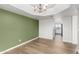 Bright dining room features wood floors, modern lighting and green accent wall at 19333 N 68Th Ave, Glendale, AZ 85308