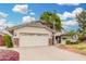 Charming two-story home featuring a three car garage and green landscaping at 19333 N 68Th Ave, Glendale, AZ 85308