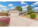 Inviting home with a spacious driveway and manicured landscaping adds curb appeal at 19333 N 68Th Ave, Glendale, AZ 85308