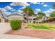 Charming two-story home with a lush, well-manicured front yard and a brick-accented facade at 19333 N 68Th Ave, Glendale, AZ 85308