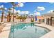 Lush backyard pool area with stone pavers and desert landscaping at 19333 N 68Th Ave, Glendale, AZ 85308