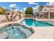 Sparkling pool and spa surrounded by lush landscaping and a fenced-in patio at 19333 N 68Th Ave, Glendale, AZ 85308