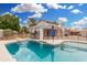 Beautiful backyard pool with rock waterfall feature and black fencing at 19333 N 68Th Ave, Glendale, AZ 85308