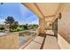 Expansive balcony with wrought iron railing, offering scenic views of the lush green landscape at 19400 N Westbrook Pkwy # 320, Peoria, AZ 85382