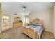 Serene bedroom with neutral walls, a queen-size bed, and well-lit vanity area at 19400 N Westbrook Pkwy # 320, Peoria, AZ 85382