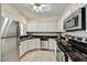 Well-equipped kitchen featuring stainless steel appliances and ample cabinet space at 19400 N Westbrook Pkwy # 320, Peoria, AZ 85382