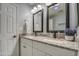 Bathroom featuring double sink vanity with granite countertop and a shower with a white shower curtain at 2006 W Summit Pl, Chandler, AZ 85224