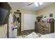 Bedroom featuring a wooden dresser, closet and a large television at 2006 W Summit Pl, Chandler, AZ 85224