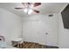 Bedroom featuring a ceiling fan, wood floors and a sliding door closet at 2006 W Summit Pl, Chandler, AZ 85224